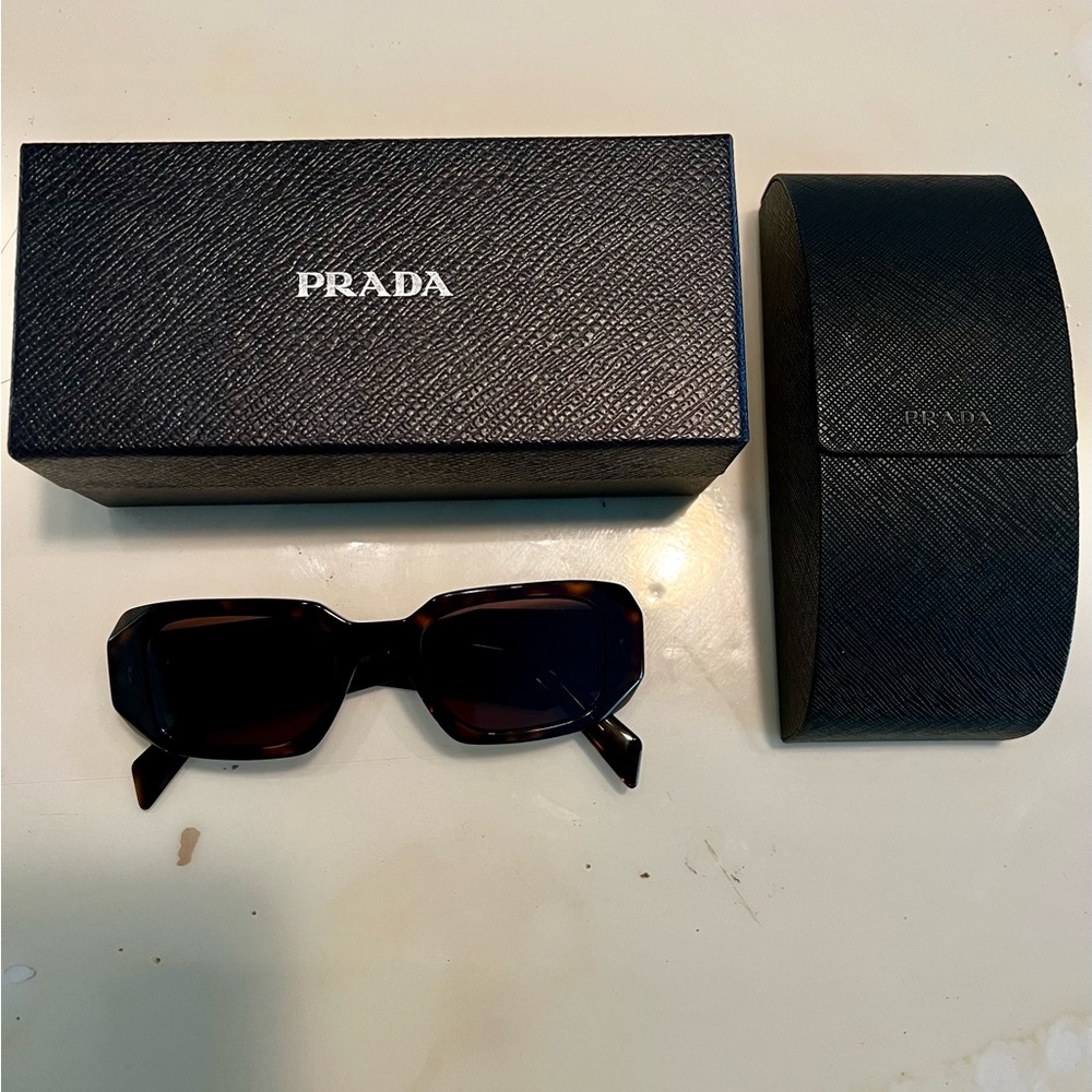 Prada tortoiseshell sunglasses.